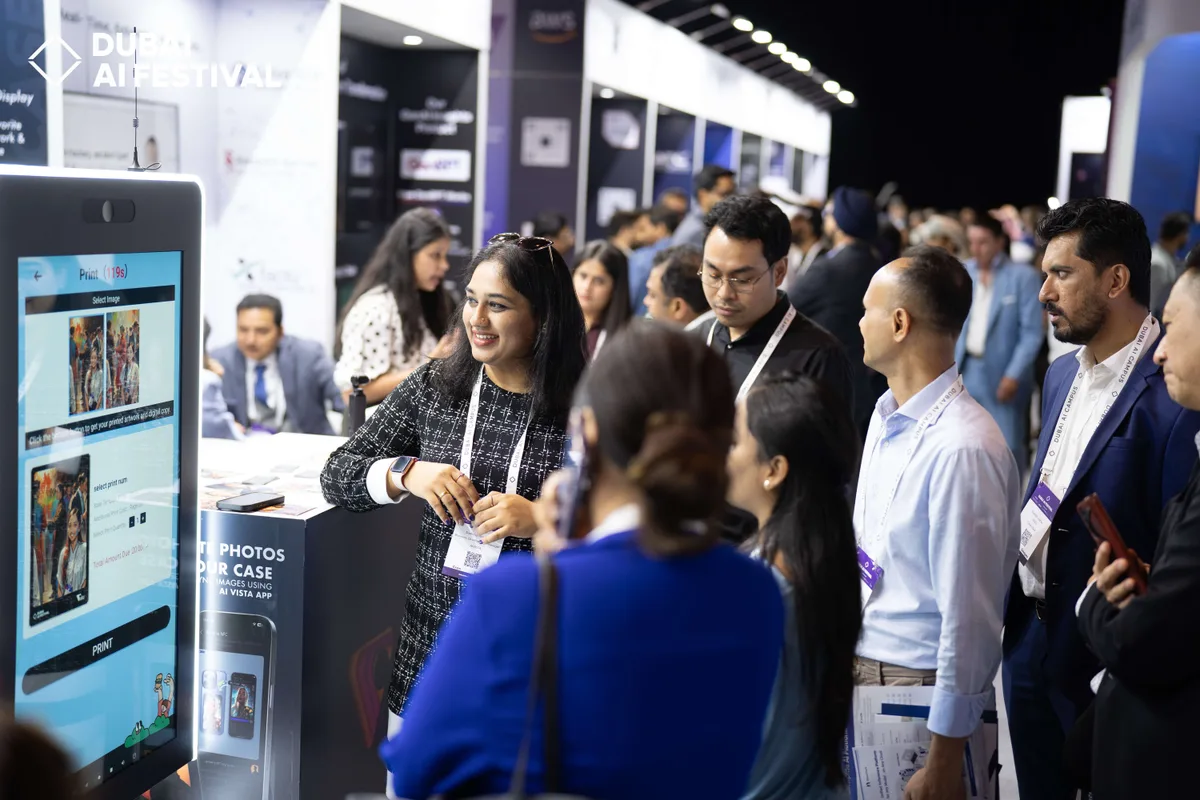 Festival visitors in conversation at an exhibition stand